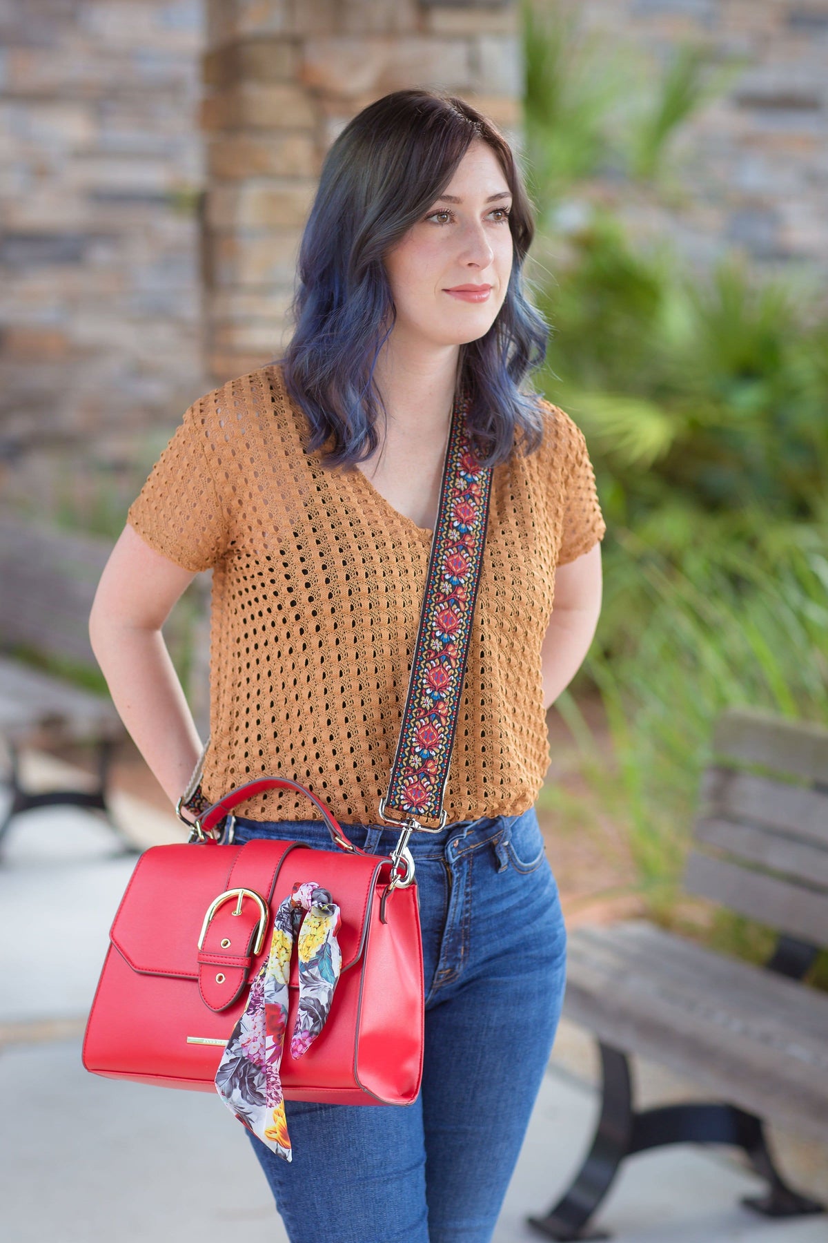 a girl with a red bag and a vintage unique handbag strap